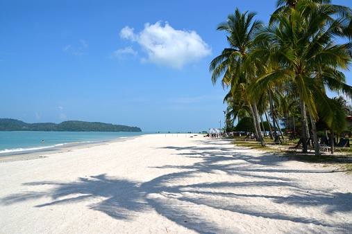 Tourists and locals enjoying Pantai Cenang, Pulau Langkawi’s most developed and popular beach, on the Andaman Sea.